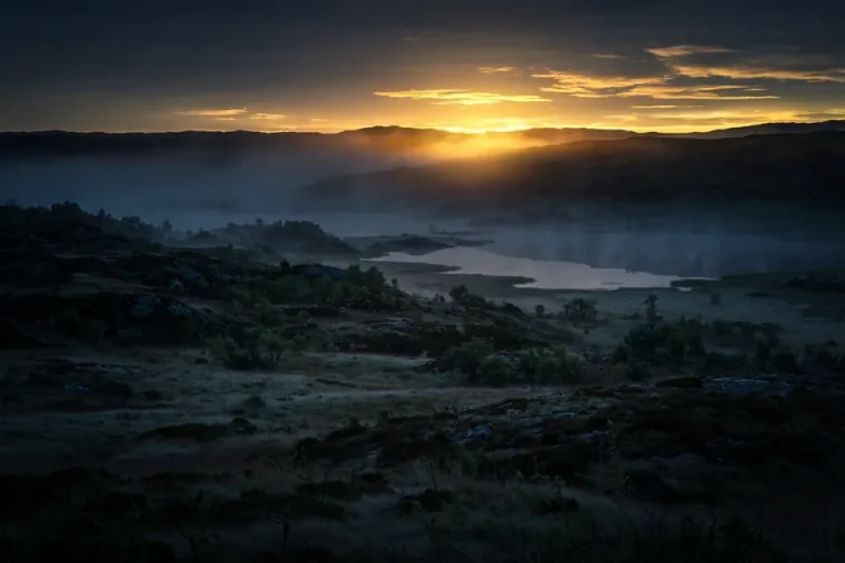 Resurrection meaning - sunrise breaking over a dark landscape symbolising rising again